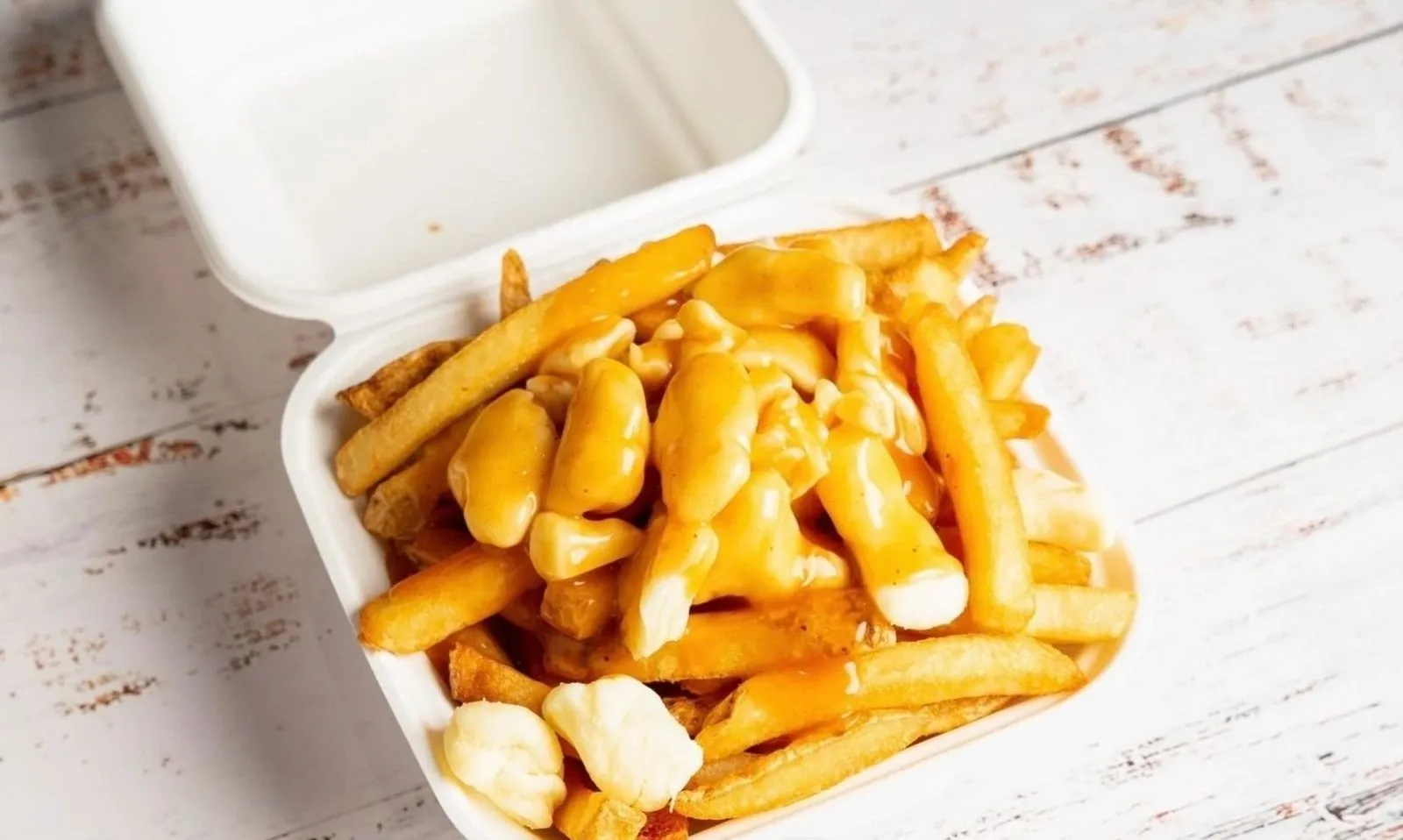 Poutine, crispy fries with cheese curds and gravy